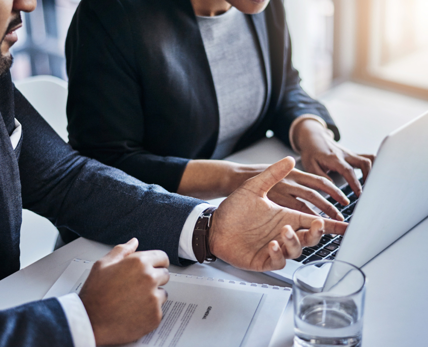 Two Businesspeople Dicsussing At Laptop