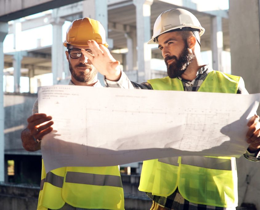 Portrait of construction engineers working on building site Portrait Of Construction Engineers Working On Building Site